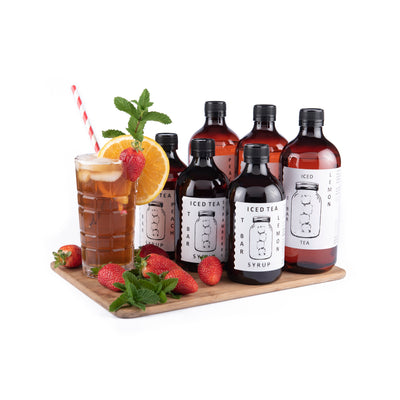 T BAR instant iced tea concentrate syrups entire range with glass and iced tea and straw with strawberries